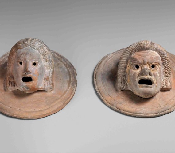 Two terracotta roundels with theatrical masks, Hellenistic, 1st century B.C., Greek, Terracotta, Overall: 3 x 5 3/4in. (7.6 x 14.6cm), Terracottas, A pair of terracotta roundels with theater masks (hetaira and slave). (Photo by: Sepia Times/Universal Images Group via Getty Images)